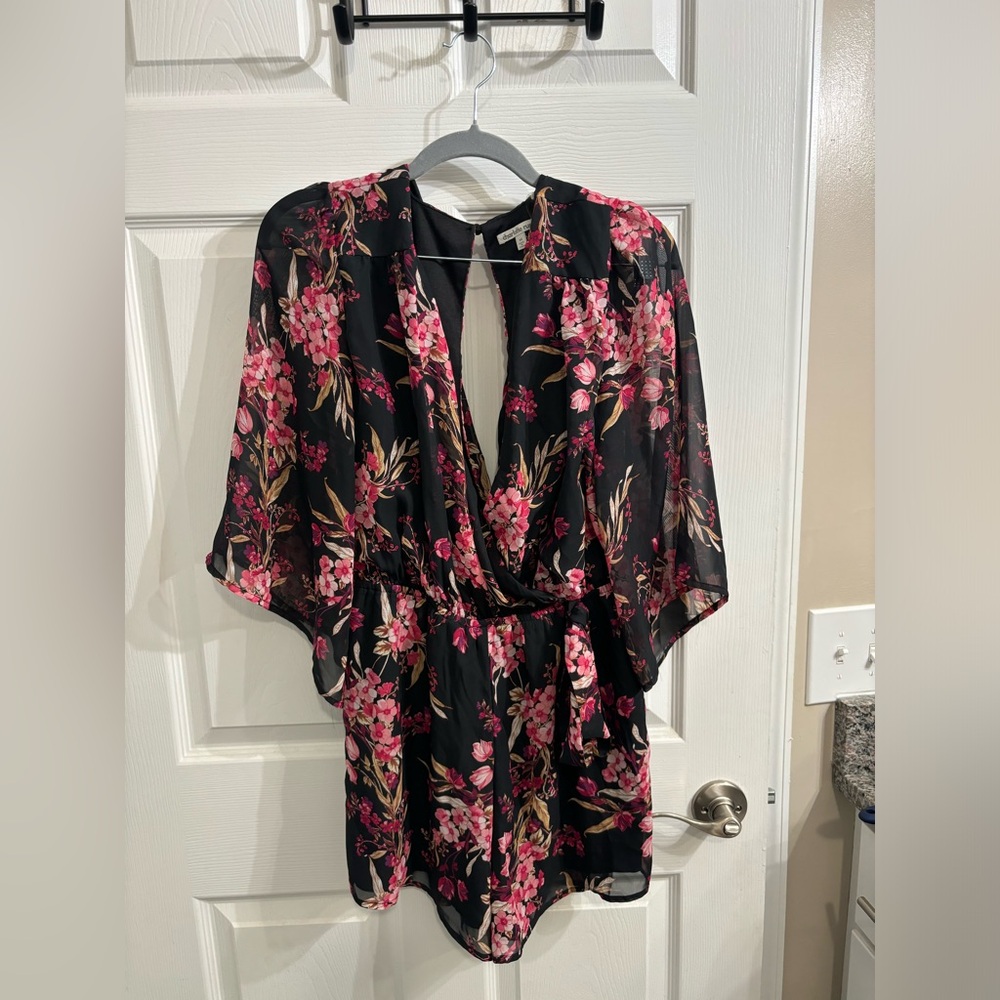 Black and Pink Floral Romper with open back. Size Medium.